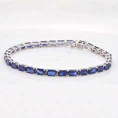 Indulge in the timeless allure of our 18K White Gold Octagon Blue Sapphire Tennis Bracelet—an exquisite blend of sophistication and elegance. Crafted with meticulous precision, this bracelet features a stunning array of octagon-cut blue sapphires, each gemstone meticulously set in lustrous white gold Timeless Sapphire Jewelry In Asscher Cut, Timeless Asscher Cut Sapphire Jewelry, Timeless Blue Bracelet For Formal Occasions, Luxury Blue Sapphire Bracelets, Formal Blue Bracelet With Polished Finish, Blue Bracelets With Polished Finish For Formal Occasions, Luxury Blue Tennis Bracelet, Timeless Blue Asscher-cut Jewelry, Elegant Octagon Diamond Bracelet For Formal Occasions