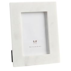 a white photo frame with the number 46 on it