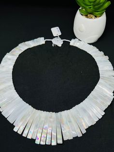 One Piece white Mother of pearl beaded necklace,  Beads Necklace. Handmade/Hand Braided Necklace Necklace length: 20.7 Inches Materials: White Mother of Pearl Adjustable length: No Can be personalized: Yes We take order work as well. Feel free to contact for purchasing goods in bulk. We are Wholesaler & manufacturers of semi-precious & precious gemstones, Loose Gemstones Beads, Cabochons. Measurements & weight are close approximations White Shell-shaped Pearl Drop Necklace, White Necklaces With Colorful Beads For Party, White Pearl Jewelry With Faceted Beads, White Necklace With Large Beads For Party, White Beaded Necklaces With Oval Beads, White Beaded Necklaces With Large Oval Beads, White Polished Bead Necklaces For Party, White Pearl Jewelry With Gemstone Beads, White Pearl Shell Necklace