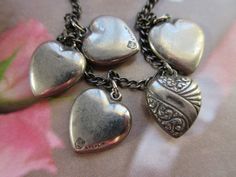 "This 1940s sterling puffy heart charm bracelet was purchased intact from a local estate. It would make a wonderful Valentines Day gift. It is a very special vintage charm bracelet that could be the start of a family heirloom collection to for a bride to be. Vintage sterling heart charm bracelets are very collectible and this one is all the more special with it's two Walter Lampl hearts. Walter Lampl charms were given to guests on the TV show \"This Is Your Life\" back in the 1950s. His jewelry Vintage Heart Beads Jewelry For Anniversary, Vintage Heart Charm Bracelet As A Gift, Vintage Heart Charm Bracelet For Anniversary, Vintage Bracelets With Heart Beads For Gift, Vintage Bracelet Jewelry For Valentine's Day, Vintage Heart Bracelet For Valentine's Day Anniversary, Vintage Heart Charm Bracelet For Gift, Vintage Heart Bracelet, Vintage Heart Bracelet For Valentine's Day