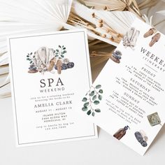 two wedding programs are laying on top of each other, with leaves and flowers around them