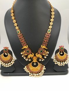 Goddess Lakshmi Peacock Red Stone Chandbali Pattern Necklace with Chandbali Very elegant and traditional necklace for this festive season. Premium quality and craftmanship Necklace Length : 18 Inches;  Earring Length : 2.5 Inches Screw Back Ready to ship from Boston, MA If you have any questions please let me know. Bollywood Style Temple Necklace With Peacock Design, Festive Temple Necklace With Peacock Design For Navratri, Festive Navratri Temple Necklace With Peacock Design, Bollywood Kundan Necklace With Peacock Design For Rituals, Bollywood Temple Necklace With Peacock Design For Diwali, Bollywood Style Temple Necklace With Peacock Design For Diwali, Diwali Gift Temple Necklace With Peacock Design, Peacock Design Necklaces For Puja And Diwali, Peacock Design Necklace For Puja And Navratri