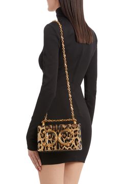 A baroque-inspired D&G logo adds to the glamour of this leopard-print leather bag featuring a pull-through strap that allows for crossbody or shoulder wear. Magnetic-snap flap closure Pull-through chain strap Leather lining Leather Made in Italy Designer Handbags Evening Leopard Print Shoulder Bag With Detachable Strap, Leopard Print Shoulder Bag With Detachable Strap For Evening, Evening Shoulder Bag In Leopard Print With Detachable Strap, Luxury Leopard Print Rectangular Bag, Luxury Leopard Print Top Handle Bag, Luxury Leather Leopard Print Shoulder Bag, Luxury Leather Shoulder Bag In Leopard Print, Luxury Leopard Print Bags For Formal Events, Evening Leopard Print Bag With Detachable Strap