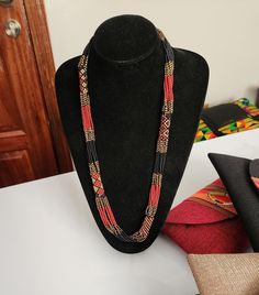 Brown African beaded necklace , Zulu necklace , Multistrand necklace , Colorful necklace. This necklace is 100% handcrafted using colorful fine beads. The necklace makes a perfect gift to loved ones. Dimensions; 32 inches. **Buy multiple items and pay shipping for 1 item only.The rest ships free. Custom orders are welcome. More neckleces here; https://www.etsy.com/shop/TribalTess?ref=seller-platform-mcnav§ion_id=21306083 Back to my shop; https://www.etsy.com/shop/TribalTess?ref=seller-platform-m Traditional Brown Hand-strung Beaded Necklaces, Traditional Brown Multi-strand Necklaces, African Beads Necklace, Artisan Multi-strand Red Necklaces, Zulu, African Beads, Colourful Necklace, Multi Strand Necklace, Multi Strand