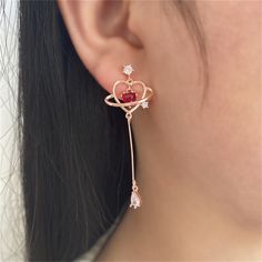 These delicately dangling drop earrings feature sparkling cubic zirconia embellishments and a dainty heart-cut crystal inside an 18-karat gold-plated open heart. 0.39" W x 1.85" L 18k gold-plated copper / red crystal / cubic zirconia Long Chain Earrings, Chain Earring, Winter Jewelry, Mother Jewelry, Japanese Kawaii, Geometric Heart, Thread Earrings, Heart Crystal, Rose Gold Heart