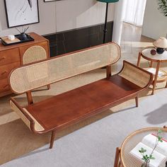 a living room filled with furniture next to a table and chair on top of a rug