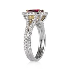 a yellow and white diamond ring with two rows of diamonds on the band, set in 18k white gold