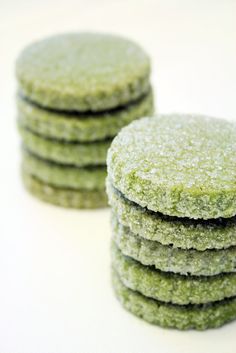 a stack of green cookies sitting on top of each other