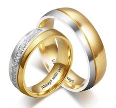 two gold and silver wedding rings with the words always love written on each one side