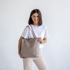 This handmade women tote bag is produced by italian soft pebbled leather. It has one pocket inside. The bag has a high-quality zipper that secures your belongings. It holds the shape perfectly and you may be confident that your things like cell phone, tablet, lap-top are safe. This bag is simple, reliable, and durable. Its universal look allows using the tote bag for various purposes. One may take the bag to the work, shopping, meeting, or walk and feel comfortable with it in any condition. SIZE Versatile Tote Shoulder Bag With Smooth Grain, Taupe Leather Shoulder Bag With Smooth Grain, Versatile Smooth Grain Tote Shoulder Bag, Versatile Tote Bag With Smooth Grain, Everyday Taupe Leather Bucket Bag, Versatile Smooth Grain Tote Bag, Taupe Textured Leather Shoulder Bag, Versatile Tote Satchel With Smooth Grain, Everyday Taupe Bucket Bag With Removable Pouch