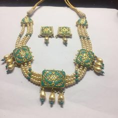 Gold moughal polki diamond Turquoise Ruby Necklace Set Gross Weight 120.6 gms 22k Gold 32.85 gms Polki Diamond 9 carats Genuine Turquoise 30 carats genuine Rubies 10 carats Pearls 150 carats CopyHCOCT2019#8S3300np4000 Turquoise Fusion Jewelry For Wedding, Turquoise Chandbali Jewelry For Festivals, Traditional Turquoise Necklace With Meenakari, Traditional Turquoise Jewelry For Diwali, Traditional Turquoise Jewelry For Gift, Traditional Turquoise Meenakari Necklace, Traditional Turquoise Bridal Necklace As A Gift, Kundan Emerald Gemstone Necklace As A Gift, Kundan Emerald Necklace As Gift