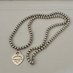 Tiffany & Co. Bead Center Heart Necklace In Excellent Condition Comes With Pouch And Box Ask Question Tiffany And Co Bead Necklace, Jewelry Tiffany, Thick Necklace, Tiffany And Co Necklace, Tiffany Co Jewelry, Tiffany And Co, Jewelry Inspo, Tiffany & Co., Heart Necklace