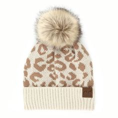 Our CC leopard beanie is trending and here to stay. It is the new neutral and can be worn and mixed with patterns all year long. We have paid particular attention to the detail on this beanie for a fashion-forward look. The super-soft material will keep you cuddly warm and trending with the added pom on top. Add it to bold plaids, plain textiles, or your ski coat for a trend that will be styling for years to come. Size: One Size.  Color: Beige.  Gender: unisex.  Age Group: adult. C C Logo, Leopard Beanie, Leopard Print Hat, Leopard Print Beanie, Knit Pom Pom Hat, Cc Beanie, Winter Cap, Pom Pom Hat, Leopard Pattern