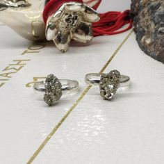 Dainty women's rings with natural raw Iron Pyrite  in Silver colour stainless steel adjustable rings, one size N 6+ Handmade in Greece Thank you for visiting my shop. May you also like: All Pyrite jewelry in my shop here: https://www.etsy.com/shop/DinasCraftsGalerie?ref=seller-platform-mcnav&search_query=Pyrite CRYSTAL NECKLACES: https://www.etsy.com/shop/DinasCraftsGalerie?ref=seller-platform-mcnav§ion_id=34688097 MACRAME BRACELETS: https://www.etsy.com/shop/DinasCraftsGalerie?ref=seller-platfo Stone Rings Women, Pyrite Engagement Ring, Iron Pyrite Crystal Meaning, Women Healing, Pyrite Ring, Pyrite Jewelry, Energy Protection, Rings Women, Pyrite Necklace