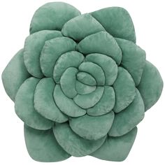 a green flower shaped pillow on a white background