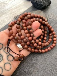 Unique and powerful Goldstone Japa mala Necklace from Nepal. A unisex piece that will be perfect for your day by day outfits and will be easy to match any other accessories. If it fits right can be a bracelet also. This is also a Buddhist praying 108 beads mala. The japa mala is 42.5cm- 16.75 inch long A unique addition to your jewelry collection. Enjoy Con salud Earthy Gemstone Beads Bracelets For Meditation, Earthy Gemstone Beaded Bracelets For Meditation, Meditation Jewelry With Wooden Round Beads, Meditation Jewelry With Round Wooden Beads, Wooden Beads Jewelry For Meditation, Brown Gemstone Beads Bracelets For Meditation, Brown Gemstone Beaded Bracelets For Festival, Festival Brown Beaded Bracelets With Gemstone, Festival Brown Gemstone Beaded Bracelets