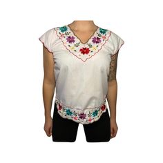 ITEM: vintage hand embroidered top, very delicate and sweet, this is a one of a kind flower child top that will never go out of style. fits like a modern day women's small. model in photo normally wears medium.  TAG READS:  n/a hand made.  MEASUREMENTS 🧵 ✂️ (Taken in inches lying flat are approximately) LENGTH:  24 inches  Measure from top to bottom.  CHEST: 18 inches ( 36 around ) Measure from arm pit to arm pit. We are happy to help you determine if the garment is likely to fit, but cannot of Multicolor Floral Embroidered V-neck Top, Bohemian Tops With Embroidered Hem For Festivals, Bohemian Festival Top With Embroidered Hem, Floral Embroidered Tops For Spring Festival, Embroidered V-neck Festival Top, Vintage White V-neck Top, Traditional V-neck Blouse With Embroidered Hem, White Casual Tops With Boho Collar, White Casual Top With Boho Collar