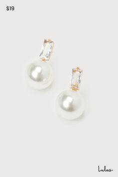 When you need to complete any special occasion look, the Lulus Elegant Passion White Pearl 14KT Gold Rhinestone Stud Earrings are the most stunning way to do so! These sophisticated earrings start with baguette-shaped rhinestone posts (with 14KT gold-plated settings) that support a gleaming, oversized faux pearl charm that completes the poised look. Make sure to wear an updo so you can show off these perfect beauties! This item is plated with real 14KT gold. Love it and it will love you back! Remove before exercising or showering, and when applying scents, lotions and sprays. Post backs. 0. 75" Long. 14K Gold Dipped Brass 25%, Glass 15%, Plastic 60%. Imported. Lulus | Elegant Passion White Pearl 14KT Gold Rhinestone Stud Earrings. Pearl And Diamond Drop Earrings, Wedding Jewelry Strapless Dress, Pearl Bride Earrings, Bride Earrings Pearl, Sophisticated Earrings, Pearl Drop Earrings Bridal, Bridal Jewellery Earrings, Pearl Bride, Formal Earrings