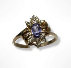 ⚓14k Yellow Gold Tanzanite Diamond Cluster Ring ( 7.25 ) Solid 14K gold, stamped 14K. Not filled or plated. In excellent condition! We sell the highest quality vintage and pre-owned items. Free domestic shipping always! On its way to you in 1 business day.  30 day return policy!  ⚓The Details Size 7.25 1 oval Tanzanite 16 round diamonds 3.1 grams ⚓Who We Are  We are a small, family-owned business in Plymouth, MA. Located in the heart of Main Street, Main Street Jewelry Co.'s mission is to find o Estate Style Oval Gold Jewelry, Vintage Gold Sapphire Ring Stamped 14k, Estate Gold Ring As Gift, Vintage Multi-stone Gold Ring, Vintage Gold Multi-stone Cluster Ring, Vintage Gold Multi-stone Ring, Gold Multi-stone Cluster Ring Collectible, Estate Style Gold Ring Jewelry, Classic Gold Multi-stone Cluster Ring