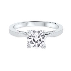 a white gold engagement ring with a round brilliant diamond