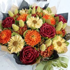 a bouquet of flowers sitting on top of a table