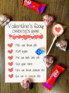 valentine's day candy dice game with candies and lollipops on the table