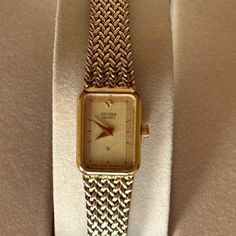 Vintage Citizen Quartz Gold Watch 1980’s Textured / Embossed Gold Plated Bracelet With Fold Over Clasp Tank Style Watch - Face Is 1/2” Wide And 5/8” Height Movement: Quartz Assembled: Frankfurt Germany Case Material: Stainless Steel Vintage: 1985 Size: 6 ½” (Adjust To 6 ¾” Larger, If Needed) Can Easily Be Sized Down Too Gently Worn And In Good Working Condition! Does Not Come In The Original Box. Beautiful Addition To Your Watch Collection! Petite, Classic, Sophisticated Yet Understated. Not Shi Tank Watch, Frankfurt Germany, Citizen Watch, Vintage Tank, Style Watch, Gold Plated Bracelets, Watch Faces, Watch Collection, 14kt Gold