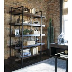 a living room filled with lots of furniture and bookshelves next to a window