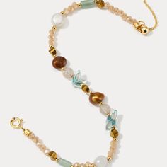 Embrace the vibrant energy of summer with our Colorful Natural Stone Beaded Bracelet! This delightful piece features a playful mix of colorful gemstones, strung on a durable brass base plated in gleaming 18K gold. Freshwater pearls add a touch of elegance, making this colored bracelet bracelet a must-have for any outfit. Whether you're dressing up for a special occasion or keeping it casual, the Colorful Natural Stone Beaded Bracelet is sure to turn heads. Find your perfect combination of natura Adjustable Multicolor Pearl Bracelet With Gemstone Beads, Gold Beaded Bracelets With Gemstone For Beach, Gold Gemstone Beaded Bracelets For The Beach, Gold Bracelets With Gemstone Beads For Beach, Bohemian Single Strand Beaded Bracelets With Round Beads, Gold Crystal Bracelet With Colorful Beads For Healing, Bohemian Gold Pearl Bracelet With Gemstone Beads, Gold Bohemian Pearl Bracelet With Gemstone Beads, Beach Bracelets With Natural Stones And Round Beads