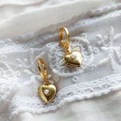 Gold Heart Locket Hoop Earrings Small heart locket with a small pearl in the centre.  The locket opens! These are the most perfect earrings! Stylish, classic and perfect for everyday wear.  Lovely little gift for daughter.  The earring open with a simple lever. Lightweight simple design, very easy to wear everyday, you won't even feel you're wearing any. Materials Hoops are high quality matt gold plate over brass with a stainless steel post.  Perfect for sensitive ears.  To keep your jewellery l Honey Jewelry, Gold Heart Locket, Gifts For Your Sister, Teen Girl Gifts, Stylish Earring, Classic Gold, Heart Locket, Small Heart, Gold Hoop