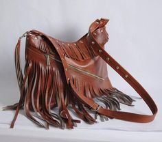 LEATHER BOHO BAG WITH FRINGESThis Handbag is the perfect size to carry your daily essentials in style! It is made from high quality leather.This leather bag is a perfect everyday bag! There is a lot of space and you can put there everything in your everyday life.* Different colors* Lining* An external pocket on the back* Includes internal pockets for mobile phone and other small items.Dimensions:height: 31 cm (12.2 in)width: 39 cm (15.3 in)strap: max 130 cm (51.2 in)***************************** Daily Use Satchel Shoulder Bag With Tassels, Leather Hobo Bag With Tassels For Everyday, Leather Satchel With Fringe For Travel, Brown Hobo Bag With Tassels For Travel, Leather Travel Shoulder Bag With Tassels, Everyday Leather Hobo Bag With Tassels, Travel Satchel Hobo Bag With Tassels, Travel Hobo Bag With Tassels, Travel Shoulder Bag With Fringe And Pouch Shape