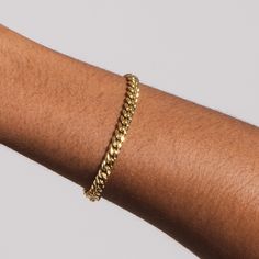 Give your outfit some extra life with our Cuban Link bracelet. This must-have bracelet can easily be worn anywhere with almost any yellow gold bracelet or watch. Plated in high-quality 18k gold, the versatile Cuban Link Bracelet is an impressive piece of jewelry that you will never want to take off. This product is guaranteed for life - GLD will repair the item should you experience any defects in craftsmanship or breakage. Specifications - Width: 5mm - Length: 6", 7", and 8" - Weight: (Weight c Classic Adjustable Cuban Link Bracelet For Everyday, Classic Tarnish Resistant Cuban Link Bracelet, Gold Plated Curb Chain Bracelets For Everyday, Everyday Gold Plated Curb Chain Bracelets, Classic Cuban Link Bracelets For Everyday, Classic Cuban Link Bracelet For Everyday, Everyday Jubilee Bracelet With Cuban Link, Everyday Tarnish Resistant Yellow Gold Sterling Silver Bracelet, Everyday Gold Plated Cuban Link Bracelet