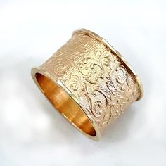 The lacy, delicate pattern is what makes this wide 10k gold ring a popular choice. It's a gorgeous wide gold ring, perfect for a wedding band, and is especially suited to a woman with long, elegant fingers. Alternative base: the ring is available with a sterling silver base: http://etsy.me/2roZkco Instead of 10k gold, the ring is also available in 14k gold. Please contact us. Width: 0.54 inch / 13.5 mm Thickness: 0.06 inch / 1.5 mm This listing is for sizes 4-11- Just convo me your size. For oth Heirloom Yellow Gold Wide Band Ring, Heirloom 14k Gold Wide Band Ring, Heirloom Engraved Ring With Decorative Wide Band, 14k Gold Filigree Wedding Ring With Decorative Band, Heirloom 14k Gold Wide Band Wedding Ring, Elegant Wide Band Ring With Decorative Band, Elegant Yellow Gold Wide Band Ring With Decorative Band, Elegant Wide Band In Yellow Gold, 14k Gold Heirloom Wide Band Engraved Ring