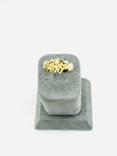 Check out this 10K solid gold Nugget ring! Features a natural rough cut for that authentic nugget design. Measures 8mm wide at the top. Gold Nugget Cluster Ring In 14k, 14k Gold Nugget Ring With Diamond Cut, Gold Nugget Ring, Gold Nugget, At The Top, Rough Cut, 10k Gold, Solid Gold, The Top