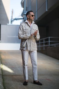 This stone colored safari shirt jacket is cut from pure suiting weight linen and is great for layering or wearing on its own. The four pocket front reflects the garments practical origins and the belt gives it shape as you see here. Its as apropos for wear on the Serengeti as it is on your - likely more regular - urban safaris. Safari Shirt, Safari Jacket, Modern Gentleman, Outfit Combinations, Well Dressed Men, Jacket Style, Well Dressed, Classic Looks, Mens Clothing Styles