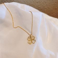 A classic piece for any jewelry collection, this beautiful gold plated four-leaf clover necklace is the perfect gift for any occasion. Each charm hangs on a fine gold plated chain and is polished to bring out its natural luster and shine. Perfect for yourself or as a gift for someone special, this beautiful necklace will make you feel like a lucky charm. Estimated Shipping Time: 5-8 business days 30-day Return Window Composition: Copper Gold Plated Heart Four-Leaf Clover Shape Necklace Clover Leaf Jewelry, Clover Necklace Gold, Gold Flower Pendant Necklace For Good Luck, Gold Charm Necklace With Flower Shape Clavicle Chain, Kalung Aesthetic, Surprise Birthday Decorations, Clover Jewelry, Four Leaf Clover Necklace, Baby Dress Design