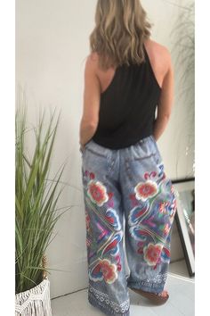 Details Size Chart These hippie print trousers combine the classic look of denim with a unique printed floral design. The elasticated waistband features a drawstring for comfort and style. In addition to its long, wide legs, these pants offer a flattering and stylish silhouette. Length: Ankle-Length Material: Polyester Elasticated waist with ties Style: Vacation Wear Fit Style: Loose Fit @Note: Size: please check measurements carefully Please allow 0.5-1" difference due to manual measurement Different monitor settings means colors may differ slightly 1" = 2.54cm @ Size(inch) Waist Hips Bottom length S 24.02 42.52 42.32 M 24.8 44.09 42.72 L 25.59 45.67 43.11 XL 26.38 47.24 43.5 2XL 27.17 48.82 43.9 3XL 27.95 50.39 44.29 Bohemian Cotton Jeans For Summer, Bohemian Style Cotton Summer Jeans, Bohemian Summer Cotton Jeans, Spring High Waist Bohemian Jeans, Bohemian High Waist Jeans For Spring, Spring Bohemian High Waist Jeans, Hippie Printed Bottoms For Summer, Casual Floral Print Harem Pants For Summer, Casual Boho Print Pants For Vacation