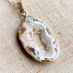 These freeform agate druzy pendants are each beautifully organic and unique. Druzies form from the Agate as tiny, glittering crystals sparkling in the light like sugar or snow. Druzy is created when water deposits crystals onto a rock’s surface. When the water evaporates and cooling occurs, the minerals are left behind and form into crystals on the rock.Choose a gold or silver toned setting and embrace the centering power of Agate in your life! Teardrop Agate Jewelry For Healing, Healing Teardrop Agate Jewelry, Agate Raw Stone For Jewelry Making, Agate Raw Stone Jewelry For Jewelry Making, Unique Raw Jewelry For Gifts, Agate Natural Stones Crystals As Gift, Natural Agate Crystal Stones As Gift, Agate Crystal With Natural Stones For Gift, Raw Stone Agate Jewelry Gift