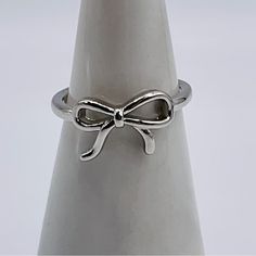 Bow Ring Size 6 Silver Plated Ribbon Cute Simple Beautiful Dainty Modern Minimal New Thank You For Stopping By My Store! Combine Items To Save On Shipping. Please Message Me If You Have Any Questions, I’m Happy To Answer Any You May Have. I Ship The Same/Next Day, As Soon As Payment Is Received Save Our Store In Your Favorites To Receive Future Sale Promotions, Discounts, And Coupons! Thanks Again, Tiffany @Grateful_times Diamond Circle Pendant, Gold Heart Bracelet, Indie Jewelry, Minimal Color, Bow Ring, Circle Diamond, Silver Bow, Crystal Brooch, Handcrafted Earrings