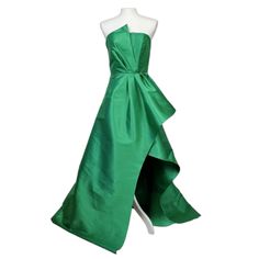 Elliatt Protea Gown In Emerald Green Size Small Brand New Waist 27" Bust 31"-32" Polyester Blend Dry Clean Recommended Partially Lined Hidden Back Zipper Closure With Faux Button Overlay Cinched Waist With Exaggerated Fabric Overlay Satin Fabric With Subtle Sheen Finish Neckline To Hem Measures Approx 63" In Length (5) Green Pre-draped Evening Gown, Green Pre-draped Evening Dress With Fitted Bodice, Pre-draped Green Evening Dress With Fitted Bodice, Green Satin Cocktail Gown, Green Sleeveless Cocktail Gown, Green Pre-draped Evening Dress For Formal Events, Green Silk Cocktail Gown, Green Silk Gown For Cocktail, Green Full-length Gala Dress