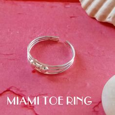 "925 Sterling Silver ring open at the back ideal for adjusting both the toes and the first phalanx of the finger. This ring is called MIDI as it is small, one size fits all, open and adjustable. It is made of 925 Sterling silver and is modern and youthful. The \"Miami Toe Ring\" is a boho chic style ring, with an ethnic and hippie air, ideal to wear in summer. The Bermuda Ring is simple and minimalist, ideal for every day. The Florida is a modern and current ring that decorates your feet with a Sterling Silver Midi Rings, Midi Rings Silver, Boho Chic Style, Midi Ring, Midi Rings, Toe Ring, Toe Rings, Boho Chic Fashion, In Summer