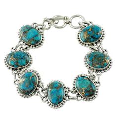 Revealing golden veins blue-green gemstones lend their mystical color to this handcrafted bracelet. Shanker designs the piece and showcases composite turquoise in ornate sterling silver settings. .925 Sterling silver Southern Jewelry, Marble Bracelet, Jewelry Facts, Native American Bracelets, Bracelet Tennis, Blue Buffalo, Silver Link Bracelet, American Indian Jewelry, Handcrafted Bracelets