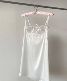 This white satin nightgown offers a sweet and elegant look. The soft satin fabric gently touches your skin, providing a comfortable sleep experience. Delicate lace details on the chest add a charming accent to the nightgown. With a princess-style design, it's both stylish and comfortable, blending vintage and modern vibes. Perfect for a wedding night or other special occasions. Additionally, this nightgown will make you feel special even in everyday use, making it a must-have piece in your wardr White Satin Nightgown, Satin Nightgown, Adult Pajamas, Princess Style, Modern Vibe, Nightgowns, Wedding Night, Feel Special, White Satin