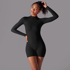 The B|Fit CONTOUR Unitard is the ultimate gym companion. With its sleek design and comfortable fit, this unitard offers both style and performance. Move freely and confidently through your workout, knowing this unitard has you covered. Perfect for any fitness enthusiast. Sporty Stretch Leotard For Workout, Stretch Dancewear Bodysuit For Sports, Sporty Black Unitard For Swimming, Solid Unitard With Thumbholes For Dancewear, Compressive Black Bodysuit For Workout, Compressive Black Workout Bodysuit, Solid Dancewear Unitard With Thumbholes, Black Compressive Bodysuit For Workout, Black High Stretch Sporty Bodysuit