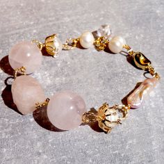 Rose Quartz and Pearls Bracelet. This bracelet measures 6.7 inches. Feminine, unique, dainty! ABOUT ROSE QUARTZ: Rose Quartz is a calming and reassuring crystal, excellent for use in trauma or crisis, including the emotional upheaval of mid-life crisis. It strengthens empathy, sensitivity, and aids in the acceptance of the necessary change. It is also an excellent stone for comforting grief. Rose Quartz also inspires the love of beauty, in oneself and others, in nature, and especially that which Elegant Adjustable Pearl Bracelet With Rose Quartz, Pink Rose Quartz Gemstone Bracelets, Elegant Rose Quartz Pink Crystal Bracelet, Pink Rose Quartz Crystal Bracelet, Pink Quartz Bracelet, Elegant Hand-strung Rose Quartz Crystal Bracelet, Personal Integrity, Imagination Art, Pearls Bracelet