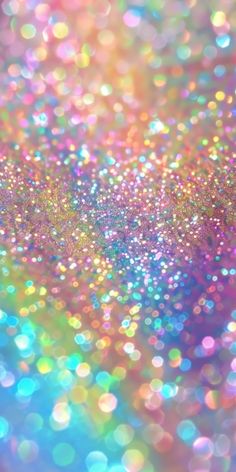 an abstract background with many colors and sparkles in the air, as well as blurry lights