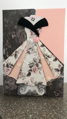 a card with an image of a dress on it