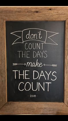 a chalkboard sign that says don't count the days make the days count