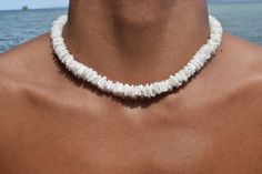 Elevate your summer style with our exquisite Natural White Clam Shell Puka Beach Summer Handmade Necklace. Perfectly crafted for men, women, and teens, this stunning accessory is more than just a necklace--it's a piece of paradise you can wear. Features: Authentic Clam Shell Puka Beads: Each necklace is handmade with natural white clam shell puka beads, ensuring unique variations and a genuine beachy feel. Versatile Design: The simple yet elegant design makes it a versatile piece, ideal for beach outings, summer festivals, or adding a touch of coastal charm to any outfit. Size Variations: Choose from a range of sizes, from chokers to longer lengths. Secure lock: We use a barrel/screw type lock, which is proven to be sturdier and have a cleaner look. Unisex Appeal: Suitable for men, women, Mens Shell Necklace, Puka Shell Necklace Men, Puka Necklace, White Shell Necklace, Chips Necklace, Puka Shell Necklace, Beach Anklets, Surfer Necklace, Beach Bracelets