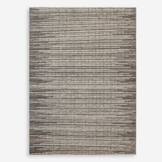 a gray and white rug with vertical stripes